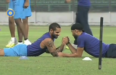 WATCH: Who wins the arm-wrestling contest between Harbhajan & Dhawan